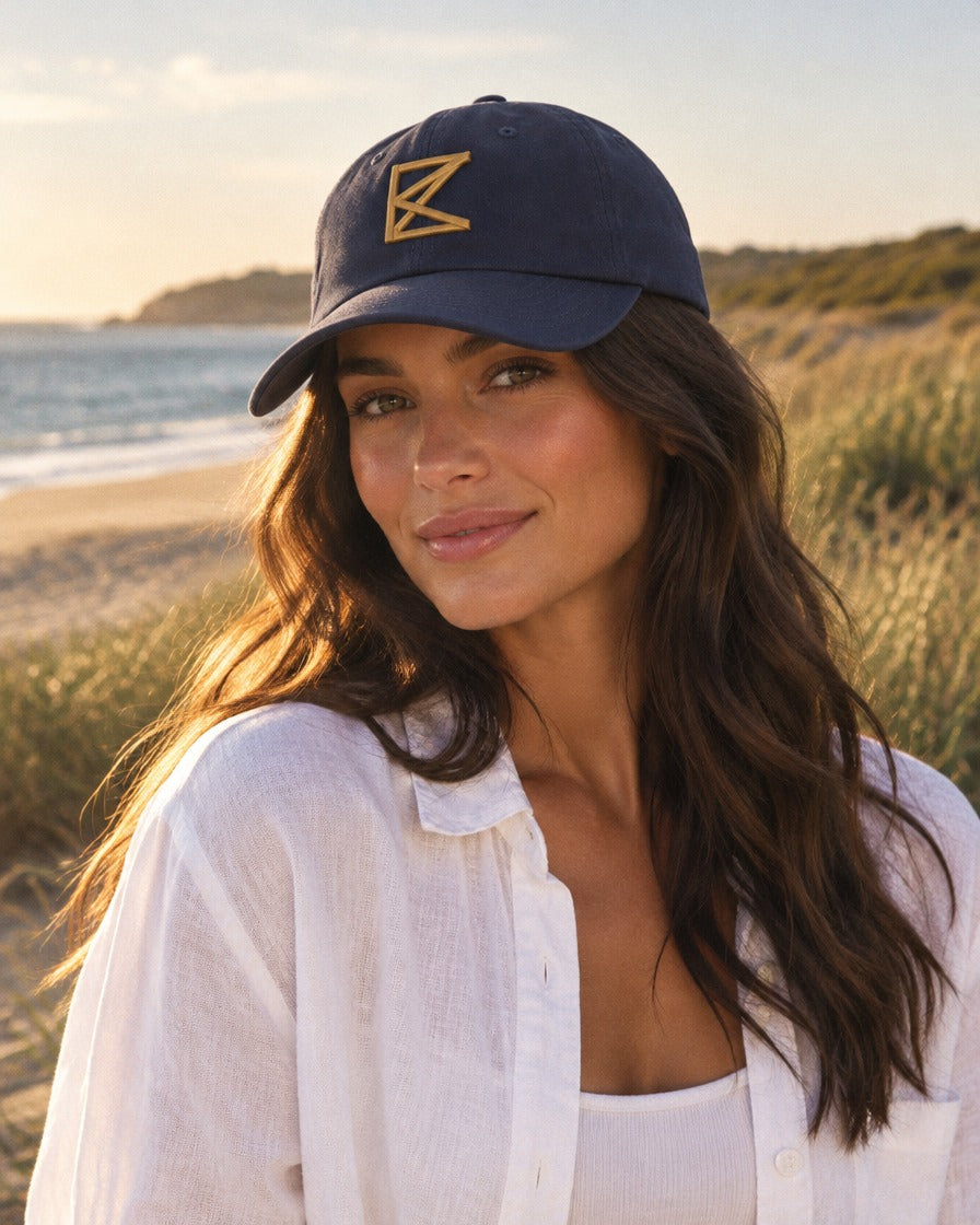 Woman wearing The Peninsula Cap on the coast (digital render)