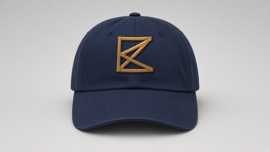 The Peninsula Cap, front: ZK monogram in old-gold 3D puff